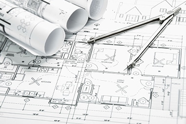 Design documents and blueprints with compass for contractors.