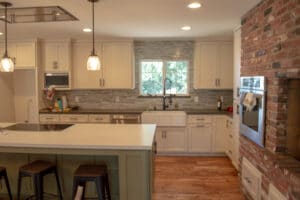 new remodeled kitchen with island and tile backsplash